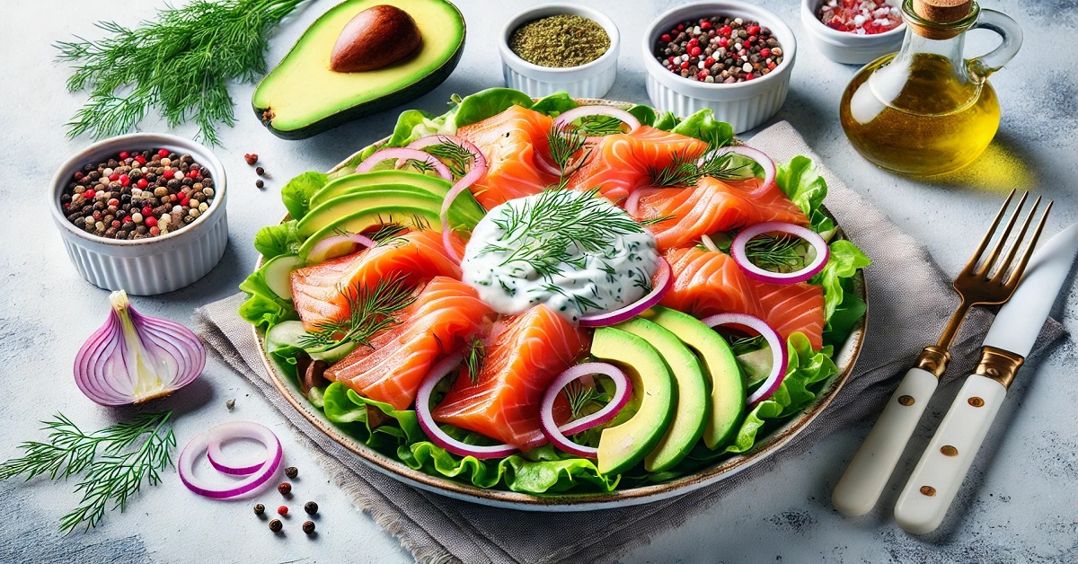 A photo of this delicious smoked salmon salad, clearly showing slices of smoked salmon with fresh avocado slices, crunchy red onions and leafy greens. A touch of dill yoghurt sauce in the middle, which gives the dish an attractive appearance and delicious flavour.